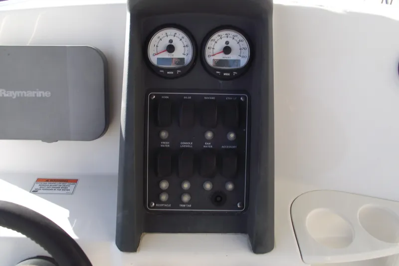 Slide: The Image of Control panel of 2011 Boston Whaler 230 Dauntless boat with gauges and switches. - 17