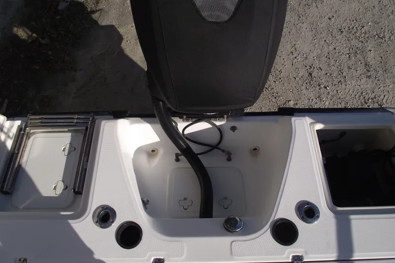 Slide: The Image of Boston Whaler 230 Dauntless 2011 boat interior with storage compartments and seating. - 24