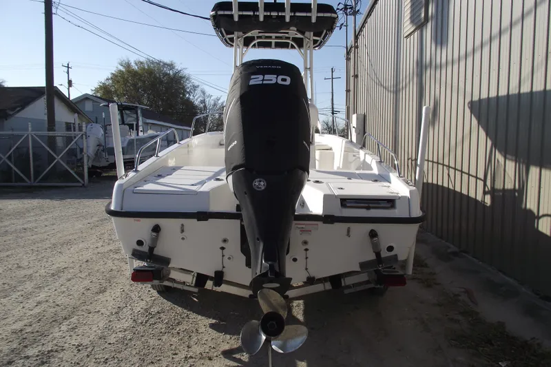 Slide: The Image of Rear view of a 2011 Boston Whaler 230 Dauntless boat with a 250 HP engine. - 3