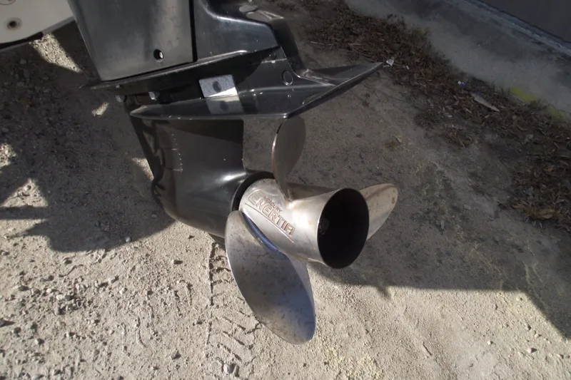 Slide: The Image of Propeller of a 2011 Boston Whaler 230 Dauntless boat on sandy ground. - 4