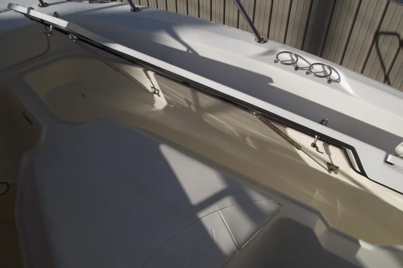 Slide: The Image of 2011 Boston Whaler 230 Dauntless boat storage compartment with open hatch. - 9
