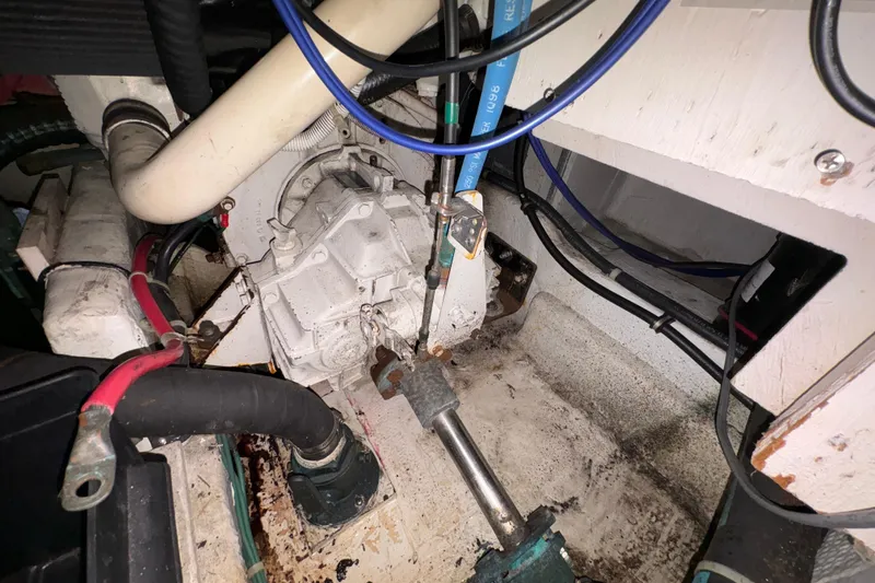 Slide: The Image of Engine compartment of 1988 Bayliner 3587 Motoryacht with visible wiring and components. - 100