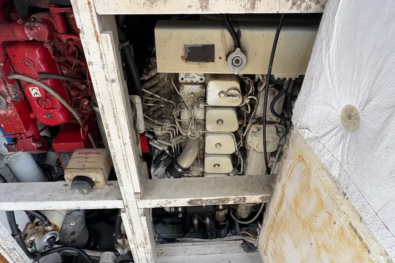 Slide: The Image of Engine compartment of a 1988 Bayliner 3587 Motoryacht, showcasing mechanical components. - 106