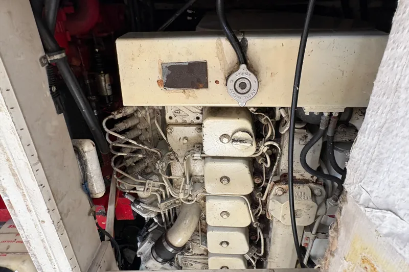 Slide: The Image of Engine compartment of a 1988 Bayliner 3587 Motoryacht, showing detailed mechanical components. - 107