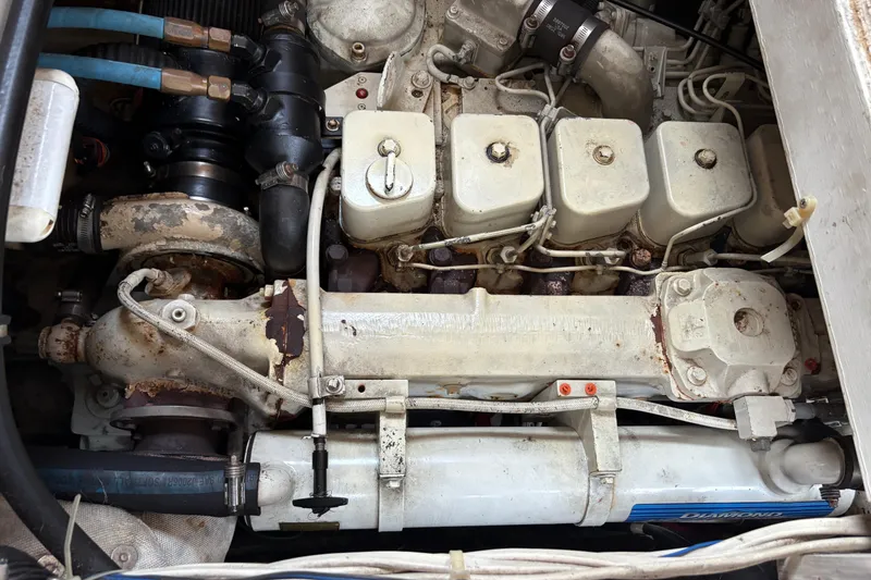 Slide: The Image of Engine of 1988 Bayliner 3587 Motoryacht, showing mechanical components and connections. - 110