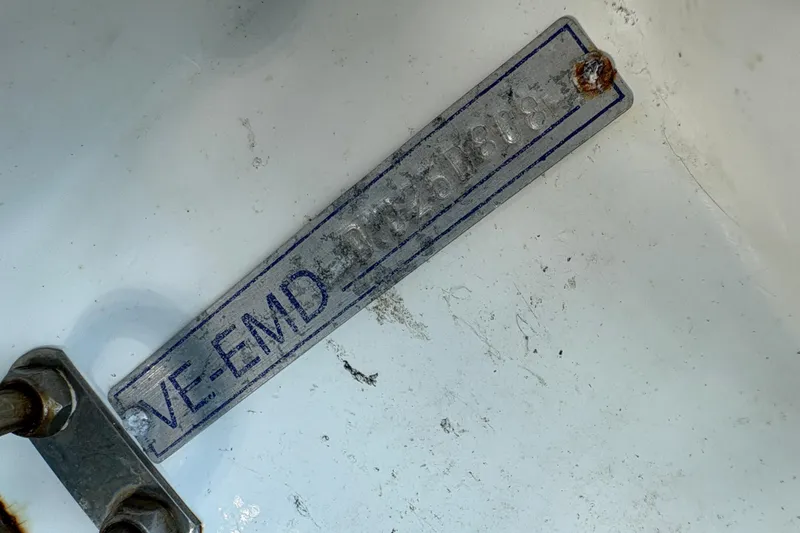Slide: The Image of Metal identification plate on 1988 Bayliner 3587 Motoryacht, showing serial number and rust. - 18