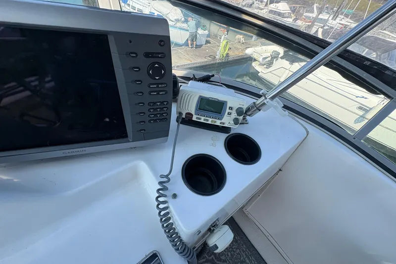 Slide: The Image of 1988 Bayliner 3587 Motoryacht helm with Garmin navigation and radio equipment. - 33