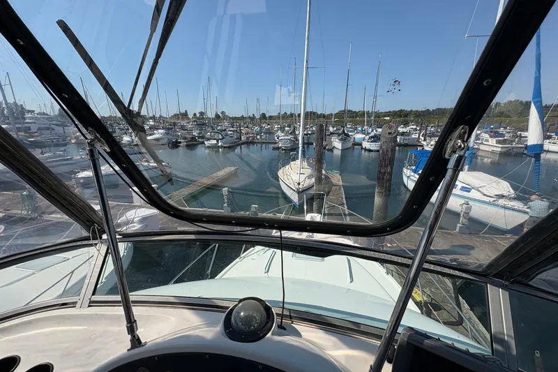 Slide: The Image of Cockpit view from 1988 Bayliner 3587 Motoryacht in a marina with sailboats. - 35