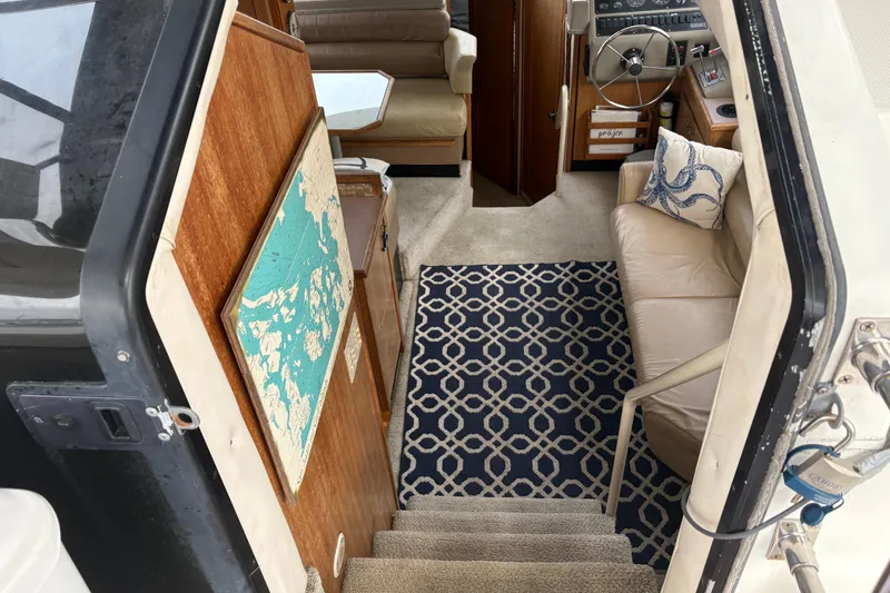 Slide: The Image of Interior view of 1988 Bayliner 3587 Motoryacht with nautical decor and steering area. - 40