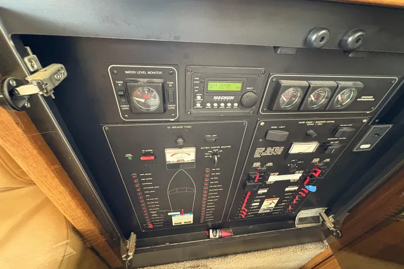 Slide: The Image of 1988 Bayliner 3587 Motoryacht control panel with gauges and switches. - 65
