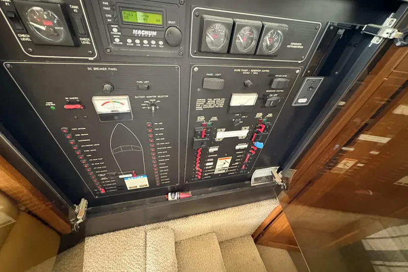 Slide: The Image of Electrical control panel on a 1988 Bayliner 3587 Motoryacht, featuring gauges and switches. - 67