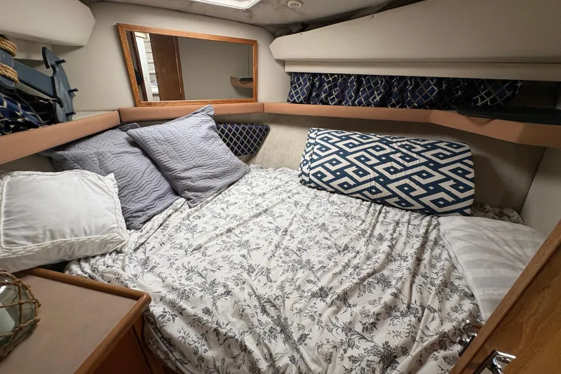 Slide: The Image of Cozy bedroom in 1988 Bayliner 3587 Motoryacht with patterned bedding and pillows. - 71