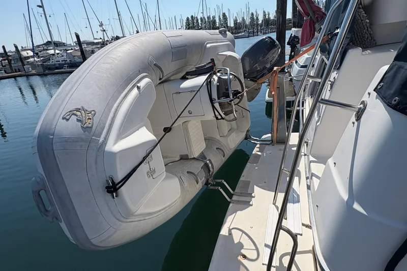 Slide: The Image of 1988 Bayliner 3587 Motoryacht with inflatable dinghy docked at marina. - 9