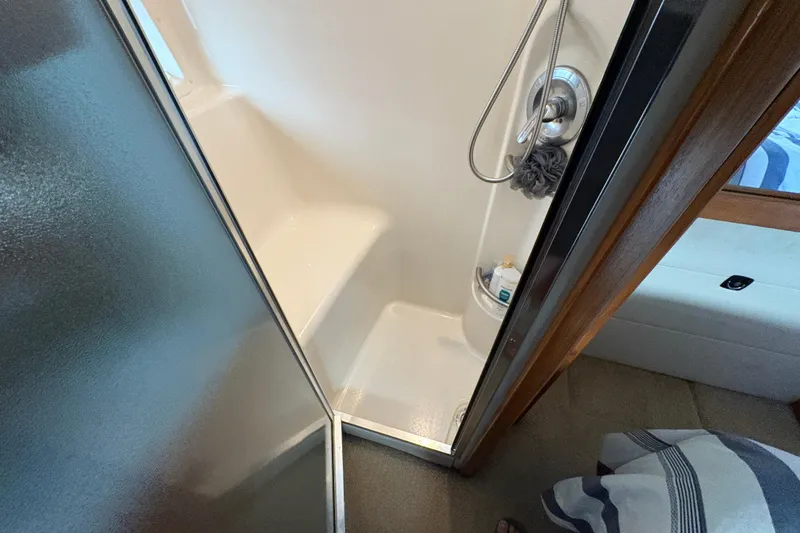 Slide: The Image of Shower area in 1988 Bayliner 3587 Motoryacht with glass door and modern fixtures. - 94