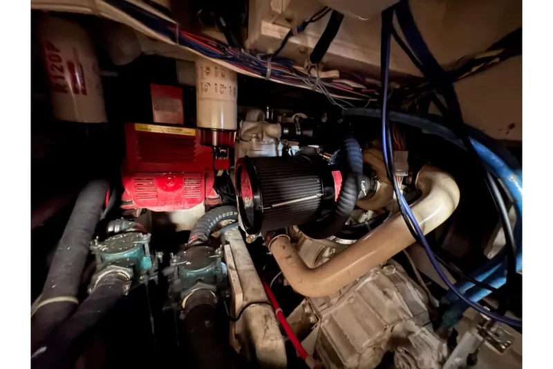 Slide: The Image of Engine room of 1988 Bayliner 3587 Motoryacht with visible components and wiring. - 97