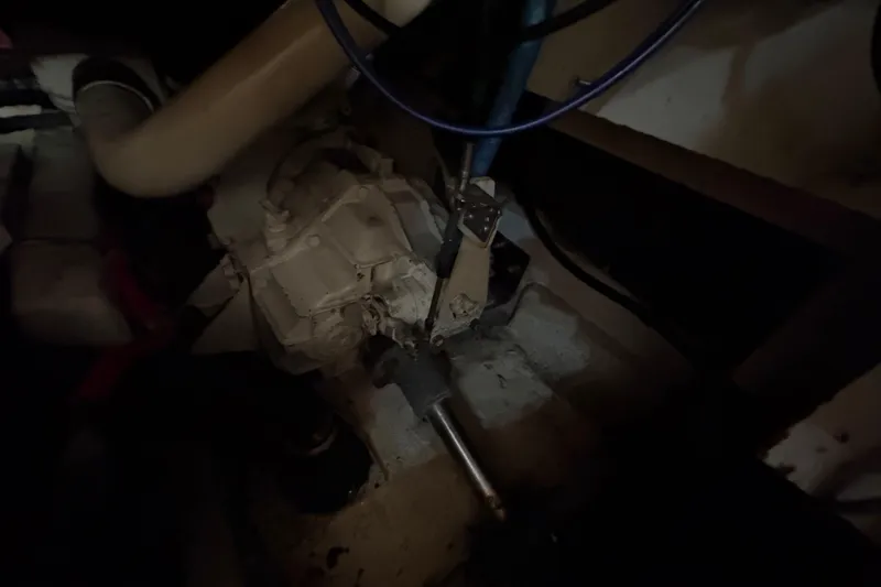 Slide: The Image of Engine room of 1988 Bayliner 3587 Motoryacht, showing mechanical components and piping. - 99