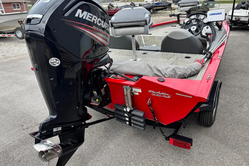Slide: The Image of 2015 Tracker Pro Team 175 TXW boat with Mercury engine, parked on pavement. - 12