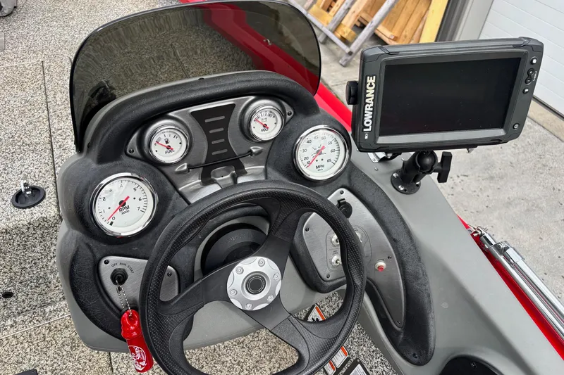 Slide: The Image of 2015 Tracker Pro Team 175 TXW dashboard with gauges and Lowrance fishfinder. - 7