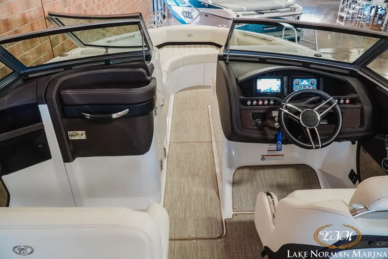 Slide: The Image of 2021 Cobalt R5 boat interior with modern dashboard and steering wheel at Lake Norman Marina. - 12