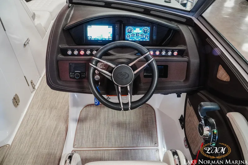 Slide: The Image of Cockpit of 2021 Cobalt R5 boat with steering wheel and control panel. - 13