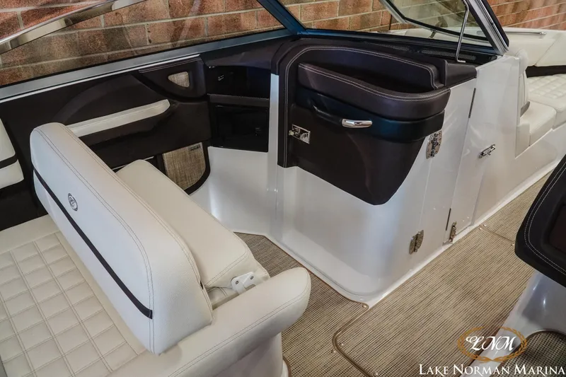 Slide: The Image of Interior of a 2021 Cobalt R5 boat with white seating and sleek design. - 14