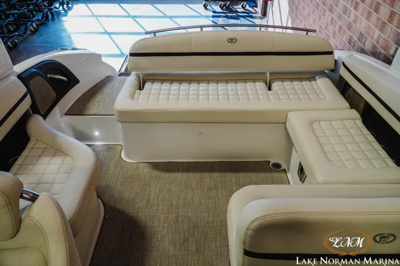 Slide: The Image of 2021 Cobalt R5 boat interior with beige cushioned seating at Lake Norman Marina. - 19