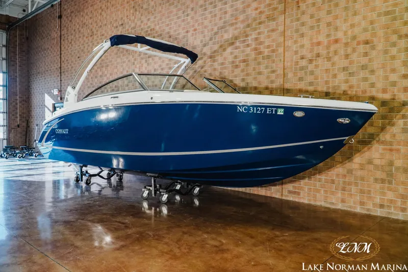 Slide: The Image of 2021 Cobalt R5 boat in showroom, blue hull, displayed at Lake Norman Marina. - 3