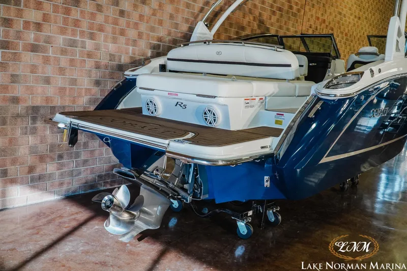 Slide: The Image of 2021 Cobalt R5 boat in showroom, featuring sleek design and powerful engine. - 6