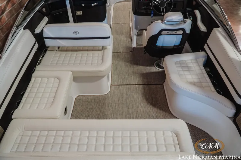 Slide: The Image of 2021 Cobalt R5 boat interior with luxurious white seating and modern design. - 9
