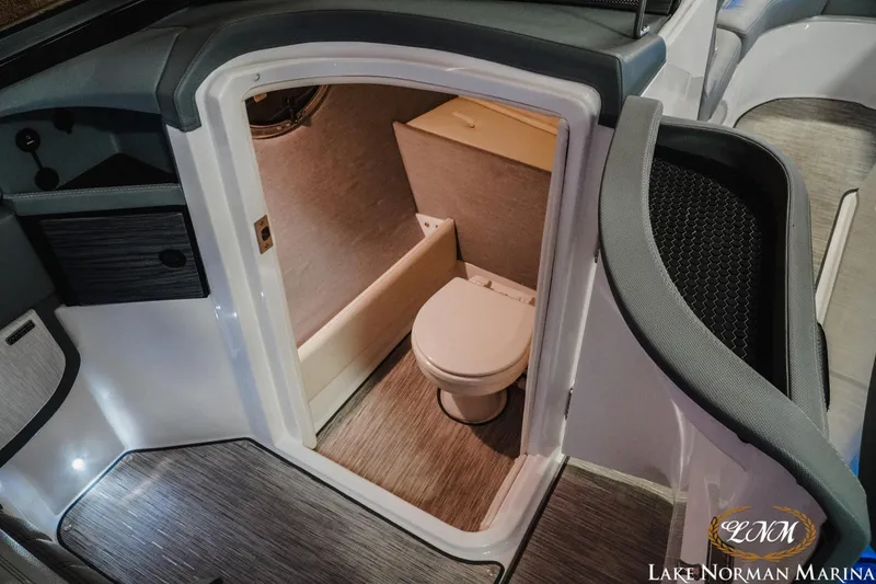 Slide: The Image of 2021 Cobalt R5 boat interior with compact bathroom and modern design. - 17