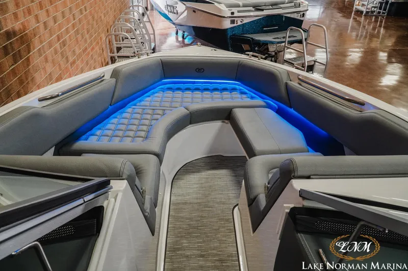 Slide: The Image of 2021 Cobalt R5 boat interior with blue LED lighting at Lake Norman Marina. - 18
