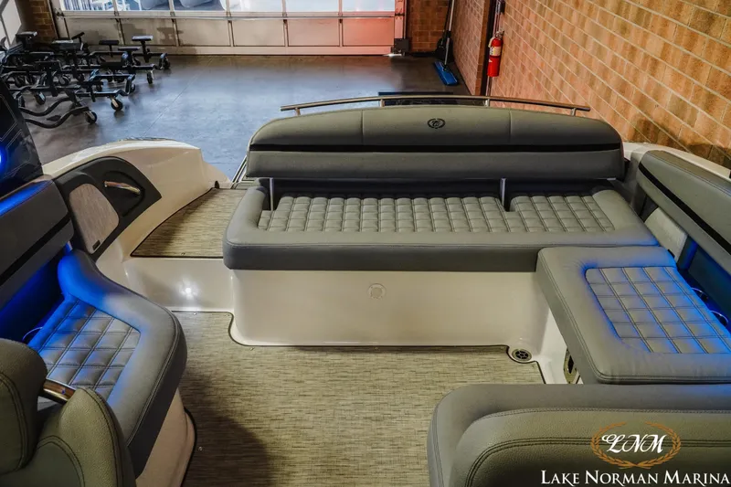 Slide: The Image of 2021 Cobalt R5 boat interior with gray seating and blue accent lighting at Lake Norman Marina. - 21