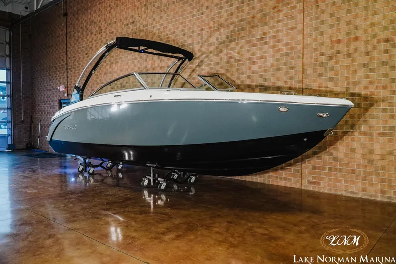 Slide: The Image of 2021 Cobalt R5 boat displayed indoors at Lake Norman Marina. - 3