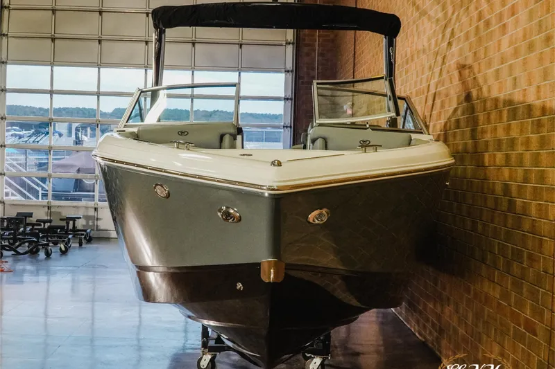 Slide: The Image of 2021 Cobalt R5 boat displayed indoors, showcasing sleek design and modern features. - 4