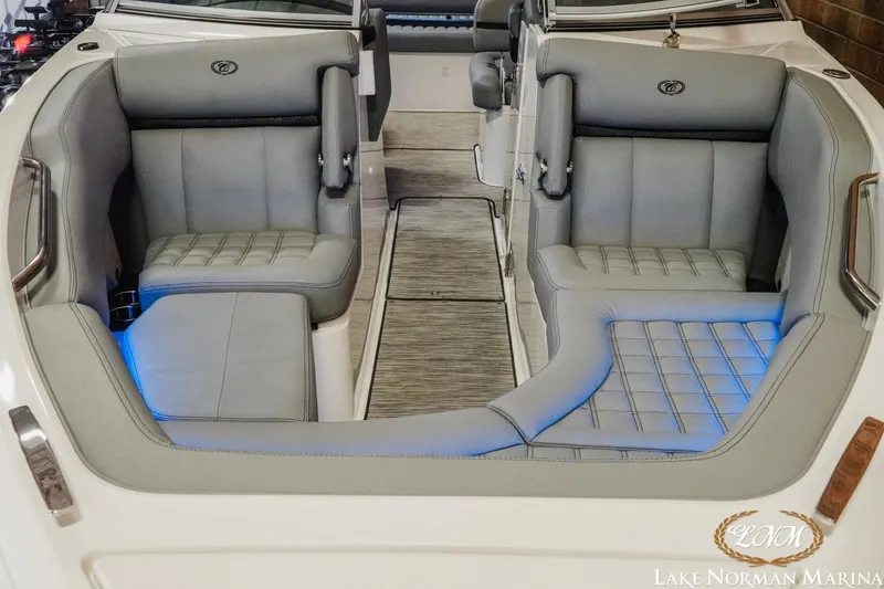 Slide: The Image of 2021 Cobalt R5 boat interior with gray seating and blue LED lighting. - 5