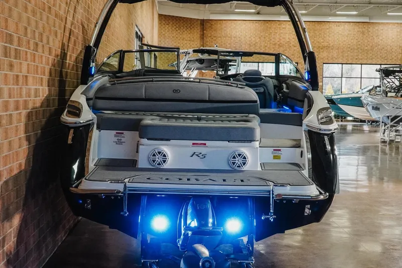 Slide: The Image of 2021 Cobalt R5 boat with illuminated stern, displayed indoors. - 7