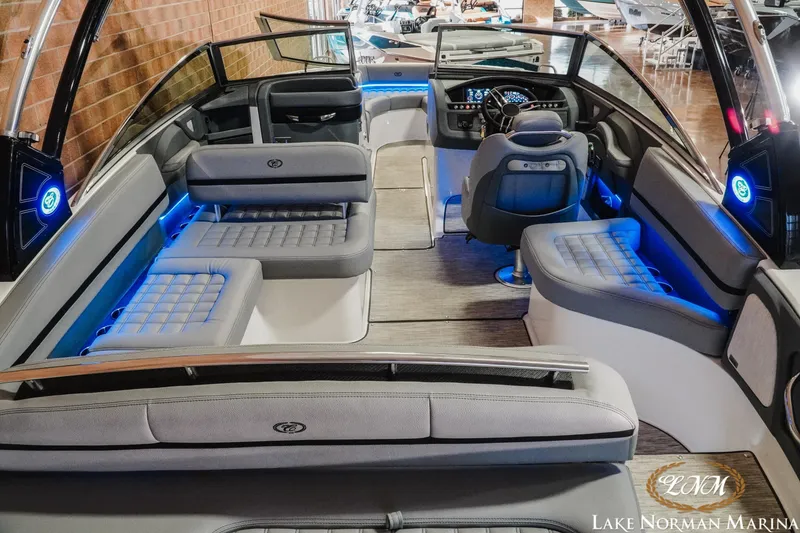 Slide: The Image of 2021 Cobalt R5 boat interior with modern seating and blue LED lighting. - 9
