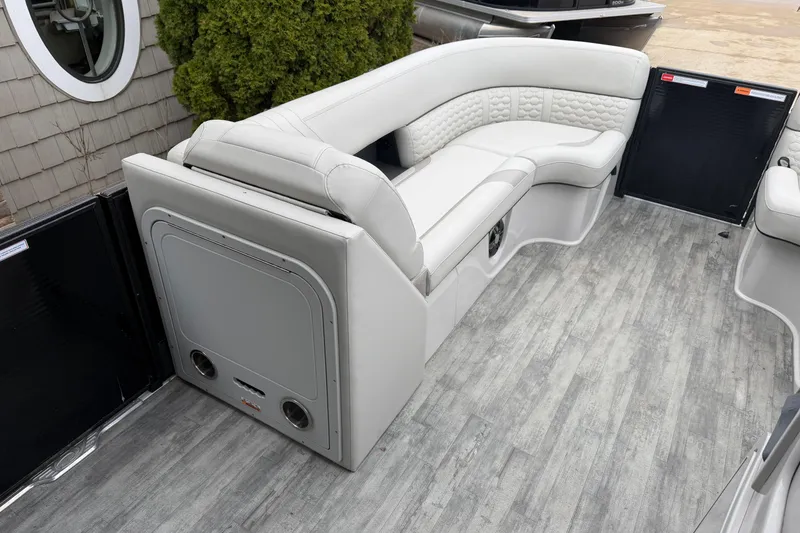 Slide: The Image of Luxurious seating on 2023 Crest Caribbean LX 230 boat with modern design and wood-style flooring. - 10