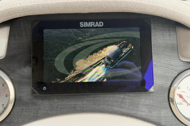 Slide: The Image of Simrad display showing 2023 Crest Caribbean LX 230 boat on water. - 13