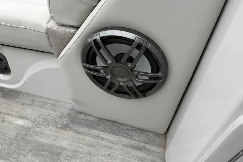 Slide: The Image of 2023 Crest Caribbean LX 230 boat interior with speaker and seating detail. - 15