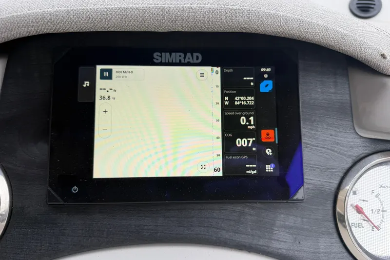 Slide: The Image of Simrad display on 2023 Crest Caribbean LX 230 showing navigation and fuel data. - 16