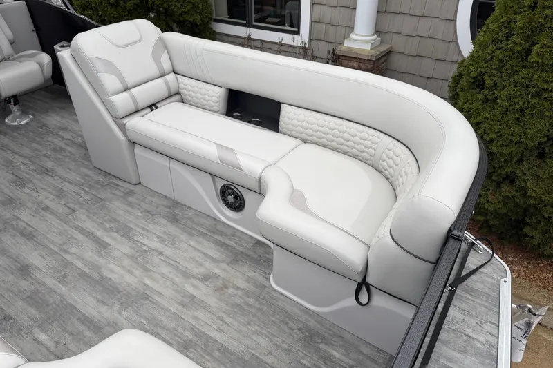 Slide: The Image of Luxurious seating on 2023 Crest Caribbean LX 230 boat, featuring elegant white upholstery. - 4