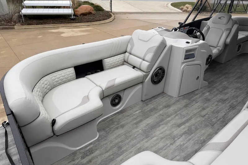Slide: The Image of 2023 Crest Caribbean LX 230 boat interior with luxurious seating and modern design. - 5