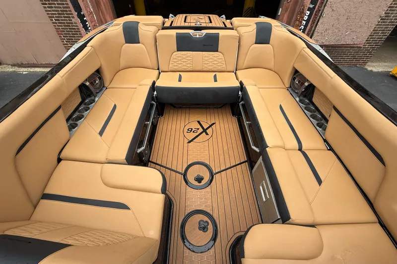 Slide: The Image of Luxurious interior of 2021 MasterCraft X26 boat with tan seating and sleek design. - 14