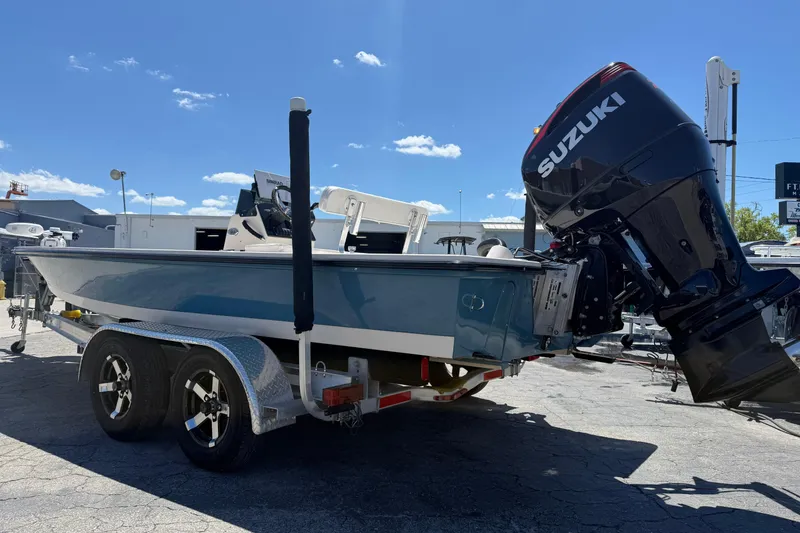 Slide: The Image of 2006 Hewes Redfisher 21 boat with Suzuki outboard motor on a trailer. - 7