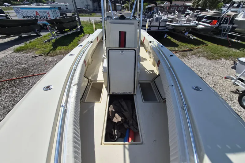 Slide: The Image of 2008 Contender 23 Tournament boat interior with open storage compartments. - 12