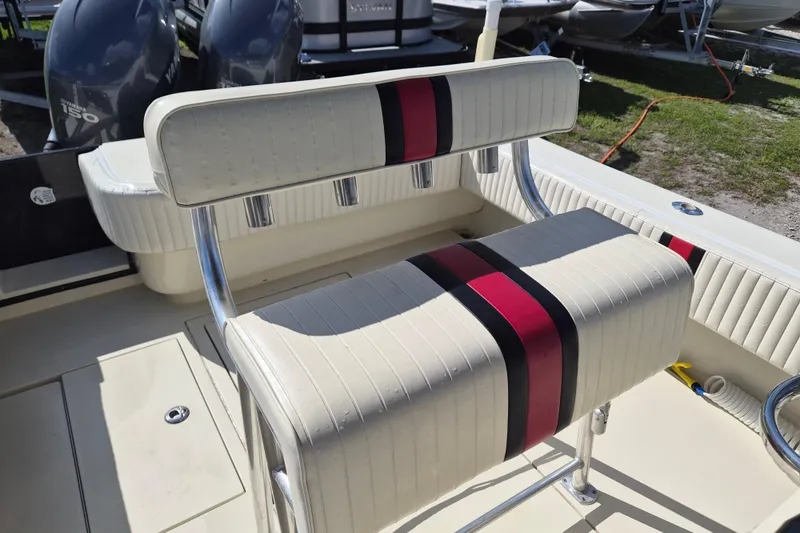 Slide: The Image of 2008 Contender 23 Tournament boat seat with red and black striped upholstery. - 13