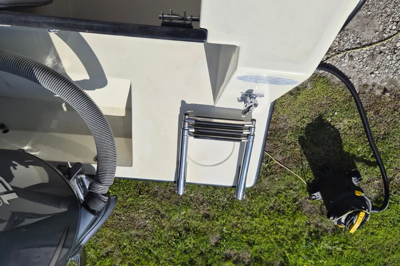 Slide: The Image of 2008 Contender 23 Tournament boat with ladder and motor, viewed from above. - 16