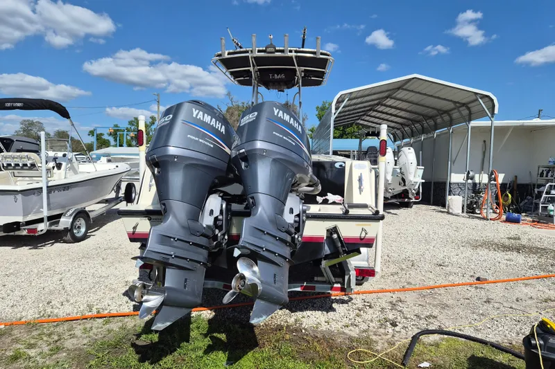 Slide: The Image of 2008 Contender 23 Tournament boat with twin Yamaha outboard motors in a sunny outdoor setting. - 3