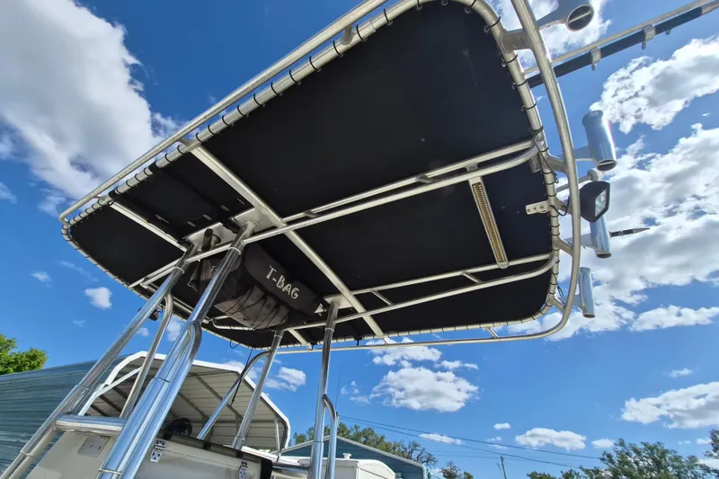 Slide: The Image of 2008 Contender 23 Tournament boat with T-top under a blue sky. - 6